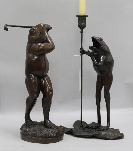 Bronze candlesticks and a golfer